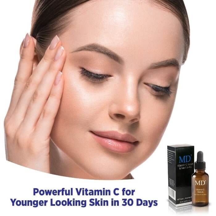 Model with MD Ultimate Vitamin C, a powerful antioxidant serum for visibly brighter, smoother, younger-looking skin in just 30 days