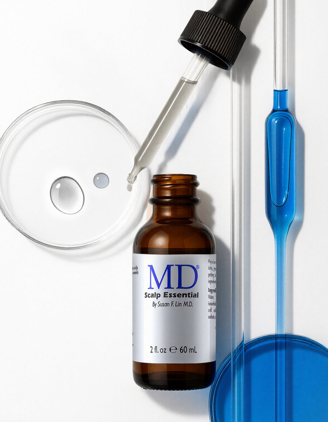 MD Scalp Essential bottle as solution for itchy scalp, dandruff flakes, and early hair loss support from the MD Hair collection