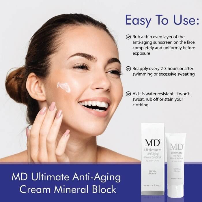 Woman applying MD Ultimate Anti-Aging Mineral Block sunscreen, demonstrating easy use and skincare benefits.